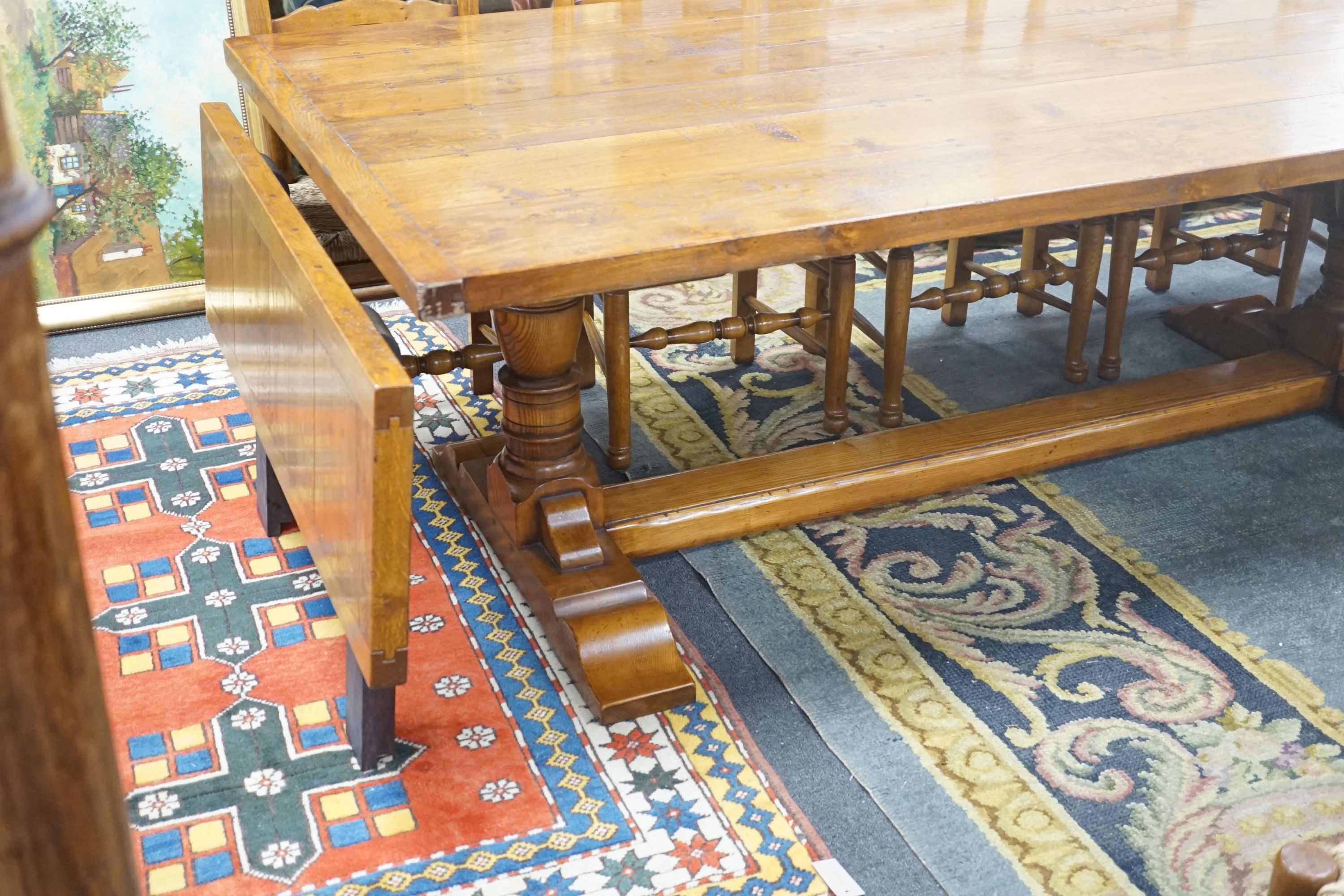 A good 18th century style Belvedere Furniture rectangular light oak refectory dining table, with end extensions, length 305cm extended, width 121cm, height 76cm